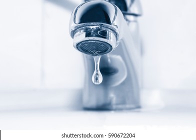 Faucet And Water Drop On White Background