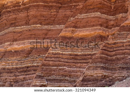 Fault lines and colorful layers in sandstone also useful as a background or texture.