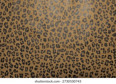 Faux leather surface with leopard-like texture