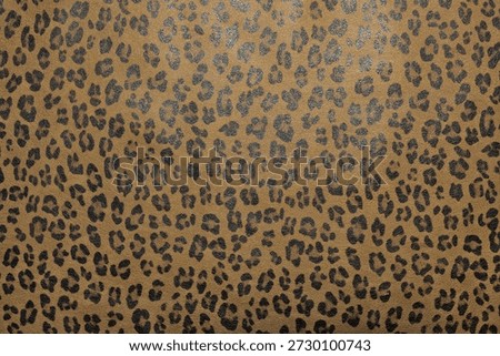 Faux leather surface with leopard-like texture