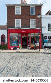 Faversham, Kent, UK - July 9 2019: Shelter Homeless Charity Shop In Pretty, Historic Market Town Of Faversham