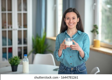 Favourite Product. A Smiling Woman Improving Her Health With Milk