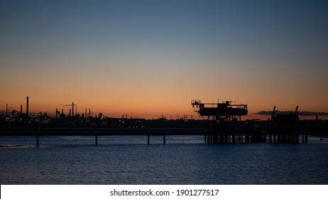 Fawley Oil Refinery Hampshire, England At Dusk. Oil Refinery Energy Production Fossil Fuels Pollution Environmental Impact