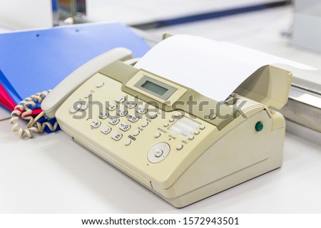 The fax machine for Sending documents in the office concept equipment needed in office 