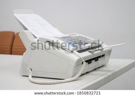 The fax machine for Sending documents in the office concept equipment needed in office 