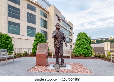 FAYETTEVILLE, AR/USA - JUNE 7, 2018: Coach Frank Broyles Statue On The Campus Of The University Of Arkansas.