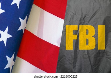 FBI agent uniform, rear view, and US flag. The inscription on the FBI jacket. Flag of America. Concept of fight against terrorism
