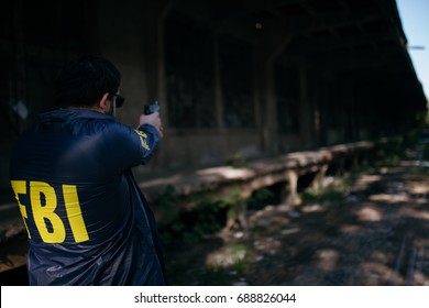 FBI Agent Using A Gun