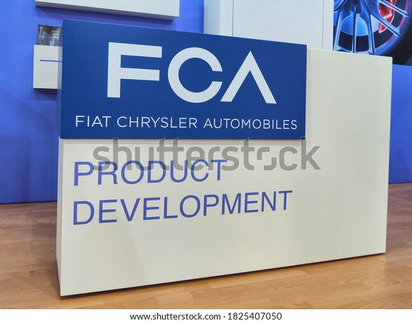 FCA automotive logo on\
technology fair booth and gadget for customers Turin Italy February\
12 2020