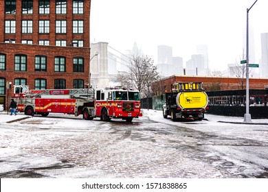 FDNY Fire Department Of New York Fire Truck In The Snow On The Street Of Brooklyn During A Winter Snowstorm Blizzard. Brooklyn, New York January 6, 2015