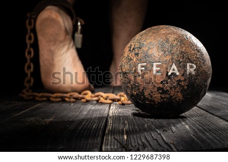 Fear is ball on the leg. Concept of fear.