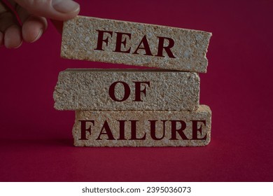 Fear of failure symbol. Brick blocks with words fear of failure. Beautiful red background, businessman hand. Copy space. Business, fear of failure concept. - Shutterstock ID 2395036073