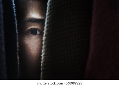 fear woman hide behind cloth with shadow edge
