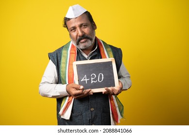 Feared Indian Politician Worried About Sentence Of Imprisionment Showing By Holding 420 Sign Board - Concept Of Criminal Or Corrupt Lawmaker And Political Crime Convict.