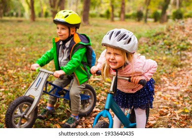 Fearless And Active Girl On A Balance Bike