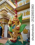 Fearsome Garuda Guardian diety statue outside the Golden Pagoda Bell tower of the Dhammikarama Burmese temple, a Theravada Buddhist shrine established in 1803 in George Town,Penang,Malaysia