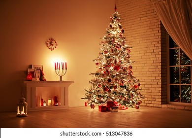 Feast of the Nativity. Beautifully decorated house with a tree and presents at Christmas - Powered by Shutterstock