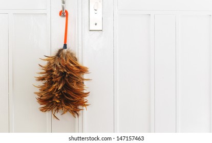 Feather Duster On White Door