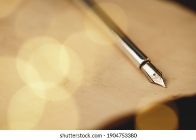 Feather Fountain Pen On Weathered Paper Close Up