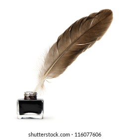 Feather pen into the inkwell. Isolated on a white background.