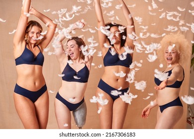 Feathers Falling On Group Of Body Positive Women Friends One With Prosthetic Limb In Underwear