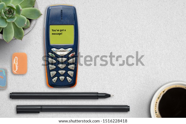 feature phone on grey\
paper background