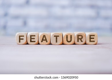 Feature word written on wood block - Shutterstock ID 1369020950