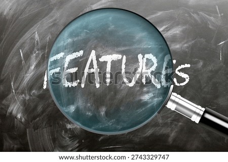 Features - learn, study and inspect it. Taking a closer look at features. A magnifying glass enlarging word 'features' written on a blackboard