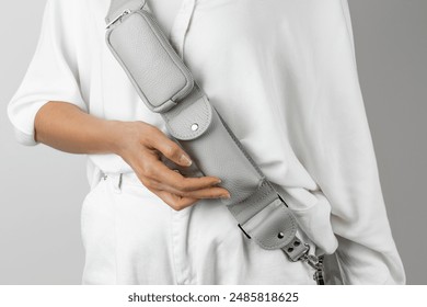 Featuring a multi-pocketed design, this leather crossbody phone case includes a detachable strap and extra storage pouches. Ideal for hands-free carrying and daily convenience.