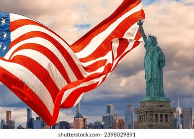 Featuring Statue of Liberty is beautifully waving American flag with Manhattan at New York City background - Powered by Shutterstock