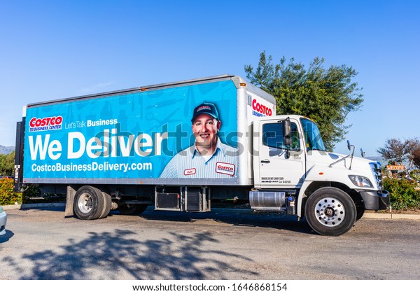 Feb 14, 2020 Milpitas / CA / USA - Side view of\
Costco delivery truck; Costco Wholesale Corporation is an American\
multinational corporation which operates a chain of membership-only\
warehouse clubs