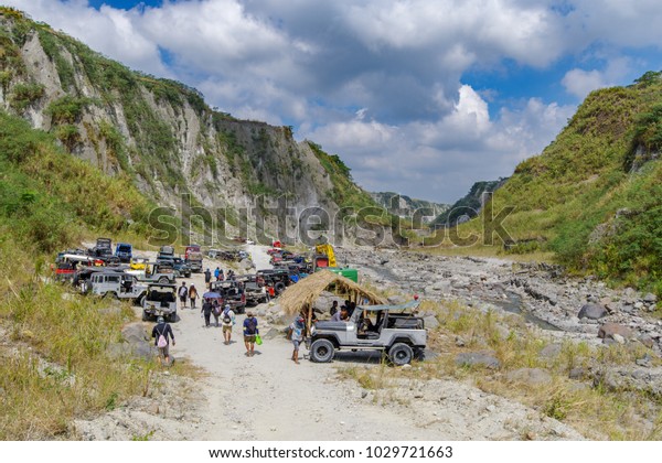 Feb 18, 2018 Four-wheel drive\
cars parked at the start of the Pinatubo hike, Capas ,\
Philippines
