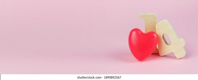 February 14 Calendar Date, Wooden Calendar, Standing On A Pink Background. Valentine's Day Greeting Card. Banner