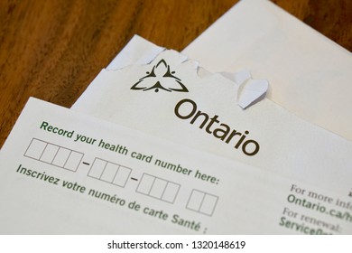 February 14th, 2019- Toronto, Canada: Paperwork To Fill Out An Application For An OHIP Card In Ontario