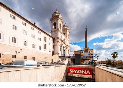 February 15, 2012: The Exterior Of The Holy Trinity Church Of The Mountains And The Obelisk Behind The Metro Entrance To Rome In Lazio, Italy