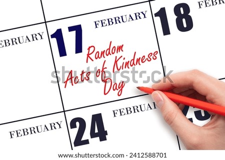 February 17. Hand writing text Random Acts of Kindness Day on calendar date. Save the date. Holiday.  Day of the year concept.