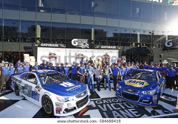 February 19, 2017 - Daytona Beach, Florida, USA:\
Dale Earnhardt Jr. (88) and Chase Elliott (24) take photos in\
victory lane after winning the pole award for the Daytona 500 in\
Daytona Beach,\
Florida.