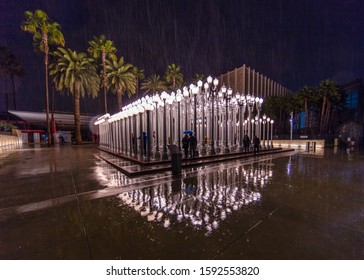FEBRUARY 2, 2019 - LOS ANGELES, CA, USA - "Urban Light" Public Art on Wilshire Blvd. is seen in rain strom at Los Angeles Museum of Art (LACMA)