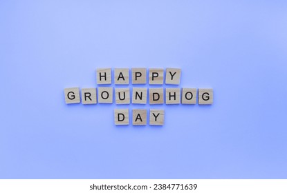 February 2, Groundhog Day, minimalistic banner with the inscription in wooden letters on a blue background