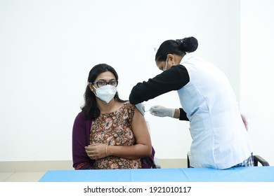 February 20,2021, Kishanganj, Bihar, India. Female Doctor Receives Covid 19 Vaccination Second Injection Shot By Nursing Staff.