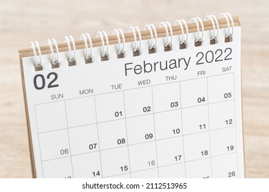 The February 2022 desk calendar on wooden background. - Shutterstock ID 2112513965