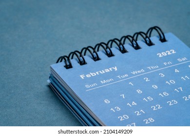 February 2022 - spiral desktop calendar against textured paper, time and business concept - Shutterstock ID 2104149209
