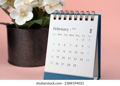 February 2024 Desk Calendar beige background - Powered by Shutterstock