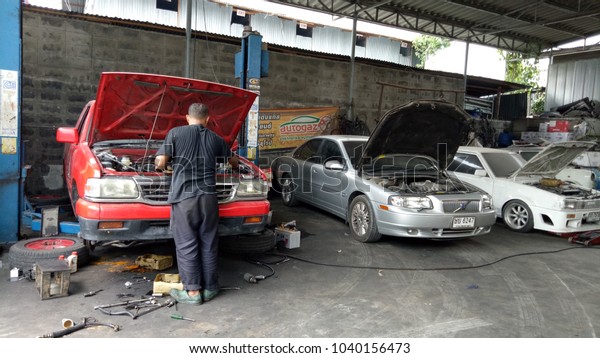February 27,
2018 The car repairman is finding the cause of the engine damage.
At the garage in Bangkok
Thailand