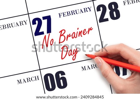 February 27. Hand writing text No Brainer Day on calendar date. Save the date. Holiday.  Day of the year concept.
