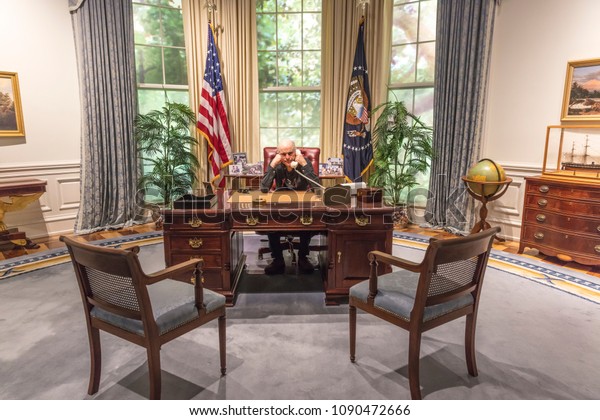 FEBRUARY 28, 2018 - COLLEGE\
STATION TEXAS - George H.W. Bush Presidential Library and Museum\
shows Oval Office shows photographer Joe Sohm sitting at Oval\
Office Desk