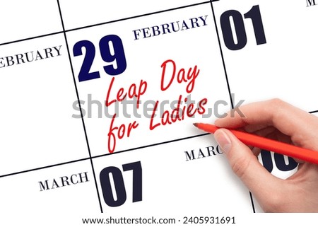 February 29. Hand writing text Leap Day for Ladies on calendar date. Save the date. Holiday.  Day of the year concept.