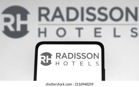 February 3, 2022, Brazil. In This Photo Illustration The Radisson Hotels Logo Seen Displayed On A Smartphone And On The Background