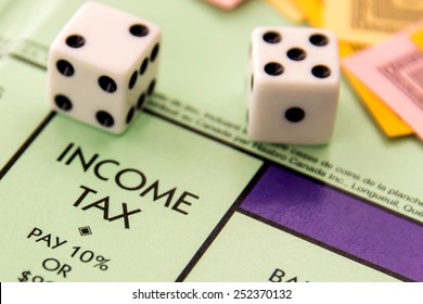 February 8, 2015 - Houston, TX, USA.  Monopoly car on Income Tax
