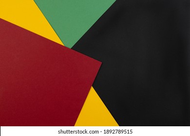 February Black History Month. Abstract Paper geometric black, red, yellow, green background. Copy space, place for your text. Top view. - Shutterstock ID 1892789515